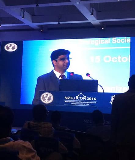 Dr. Puneet Ahluwalia speaking at a urology conference